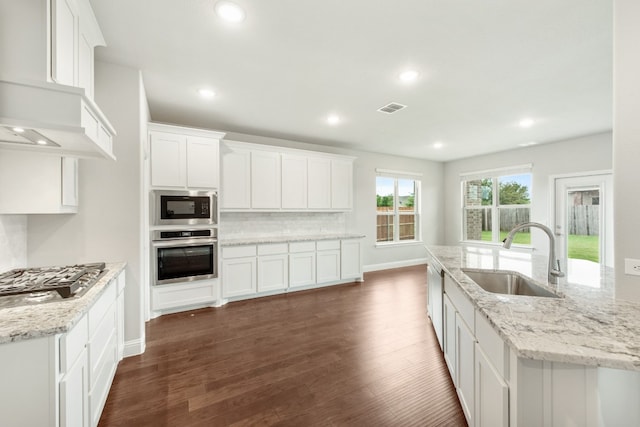 kitchen with white cabinets, sink, dark wood-type flooring, and appliances with stainless steel finishes