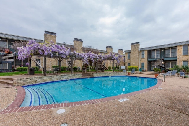 view of swimming pool with a patio