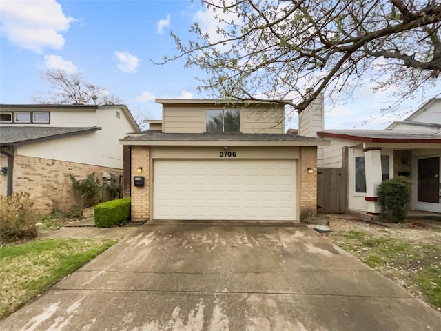 view of front of property with a garage