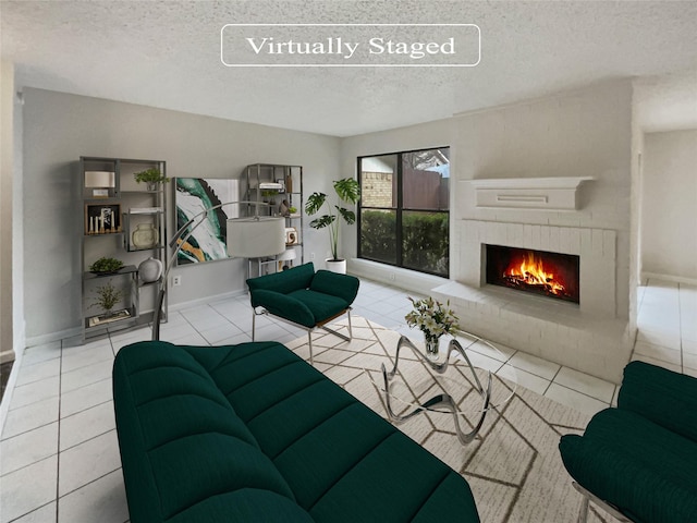 tiled living room featuring a fireplace and a textured ceiling