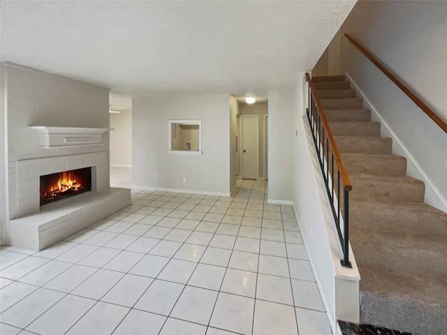 unfurnished living room featuring light tile patterned flooring