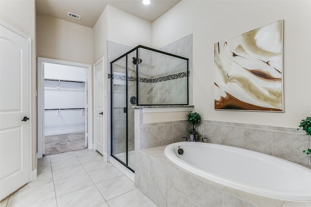 bathroom with tile patterned flooring and independent shower and bath