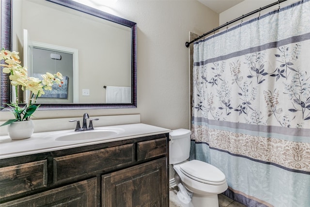 bathroom featuring walk in shower, vanity, and toilet