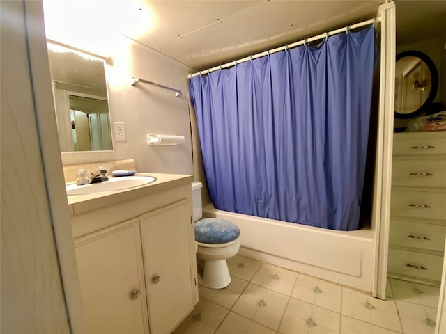 full bathroom featuring tile flooring, toilet, large vanity, and shower / tub combo with curtain