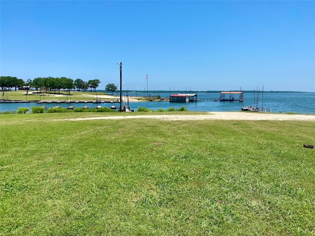 exterior space with a water view and a yard