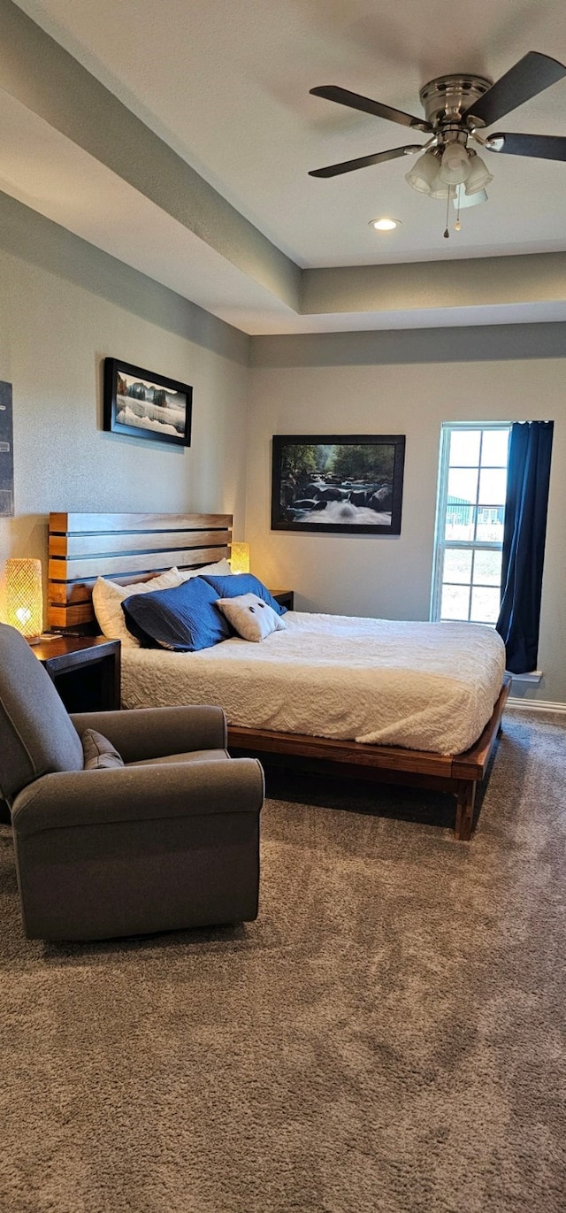 bedroom with ceiling fan and carpet