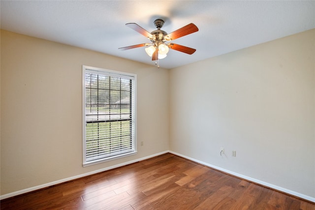 unfurnished room featuring dark hardwood / wood-style floors and ceiling fan