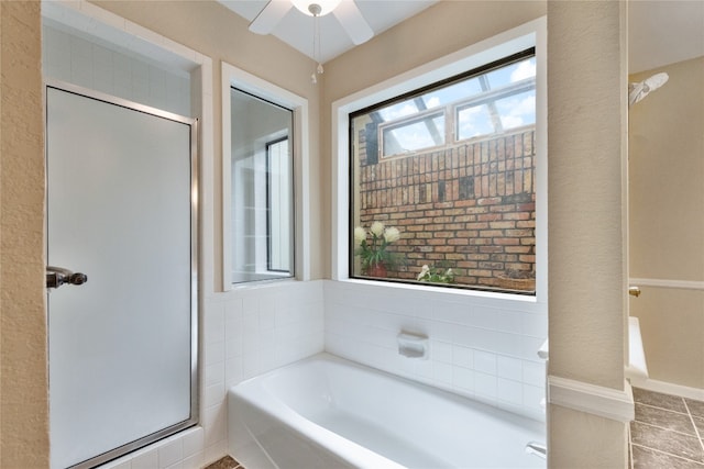 bathroom with independent shower and bath and ceiling fan