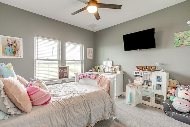 bedroom with ceiling fan and carpet floors