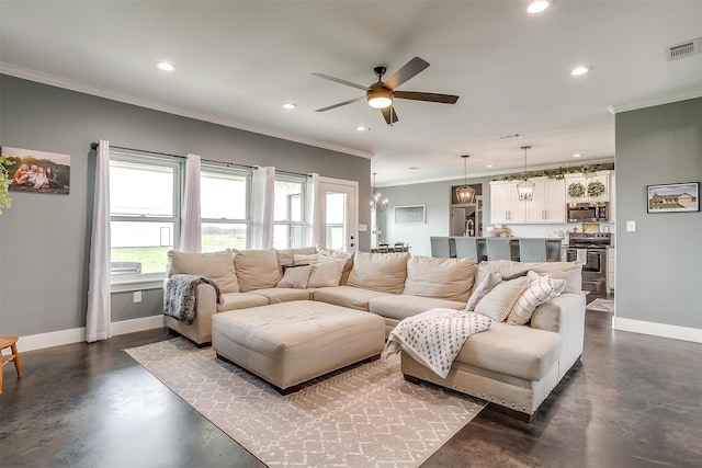 living room featuring ceiling fan with notable chandelier and crown molding