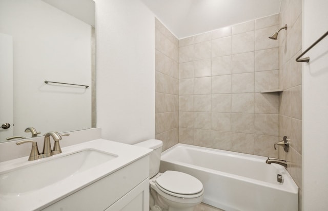 full bathroom with vanity, tiled shower / bath combo, and toilet