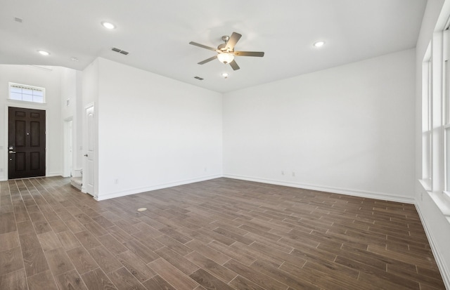 unfurnished room with dark hardwood / wood-style flooring, ceiling fan, plenty of natural light, and lofted ceiling