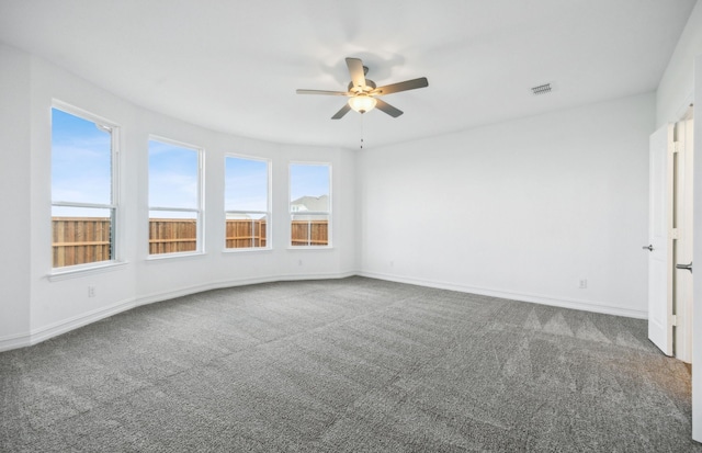 carpeted empty room with ceiling fan