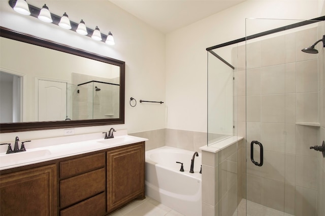 bathroom featuring dual vanity, tile flooring, and separate shower and tub