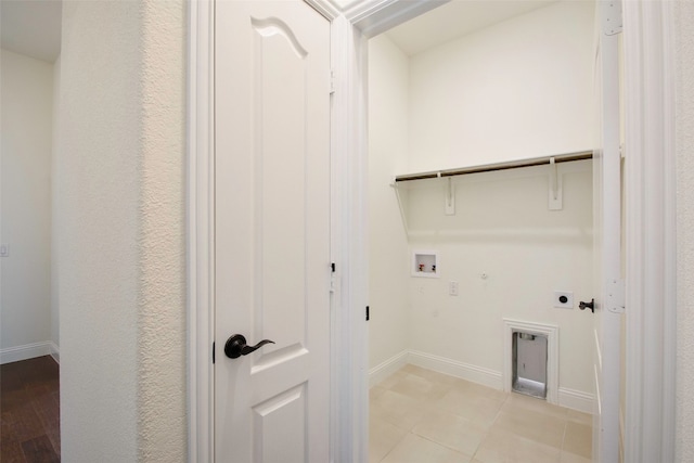 laundry area featuring light tile floors, hookup for an electric dryer, hookup for a gas dryer, and hookup for a washing machine