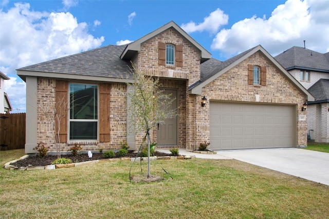 view of front of home featuring a front yard and a garage