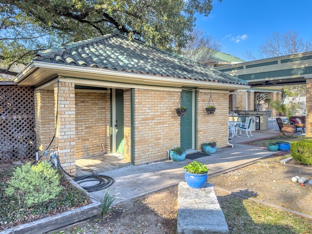 entrance to property with a patio area