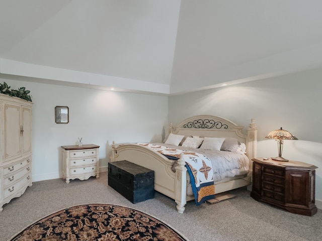 bedroom featuring high vaulted ceiling and light colored carpet