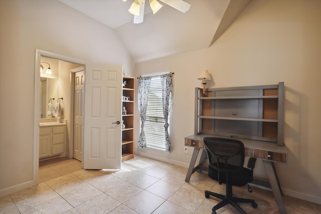 office space featuring ceiling fan, light tile patterned floors, and vaulted ceiling