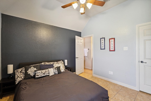 bedroom with ceiling fan, light tile patterned flooring, and lofted ceiling