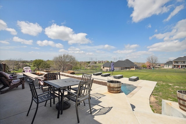 view of patio / terrace featuring an outdoor fire pit