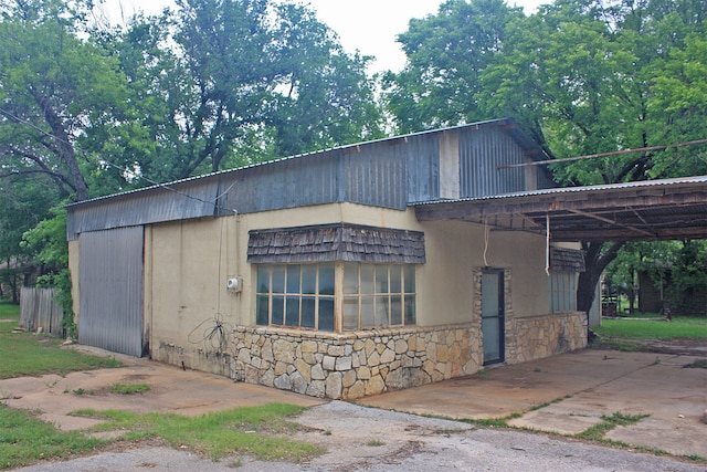 view of home's exterior with a carport