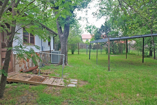 view of yard featuring central AC unit