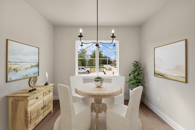 dining space with a chandelier and wood-type flooring