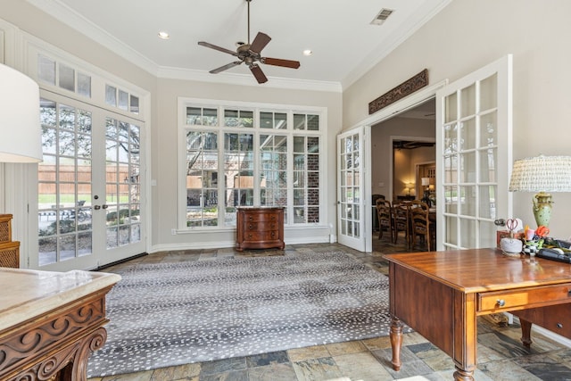 home office with plenty of natural light, ceiling fan, french doors, and crown molding