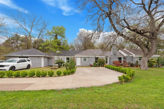 single story home featuring a garage and a front yard