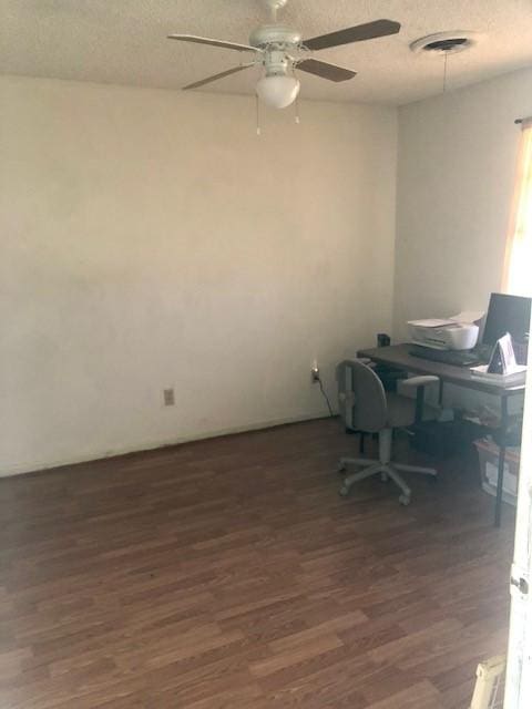 office area featuring ceiling fan, dark hardwood / wood-style floors, and a textured ceiling