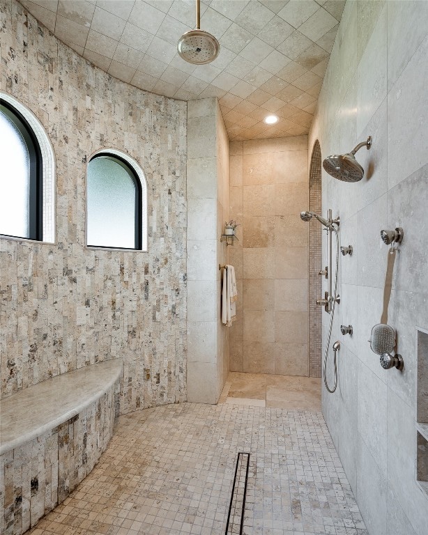 bathroom with tiled shower