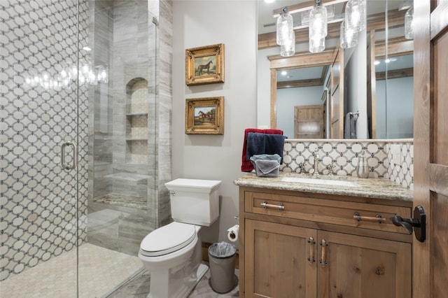 bathroom featuring toilet, a shower with door, tile floors, and oversized vanity