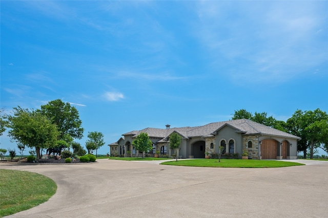 ranch-style house with a front lawn