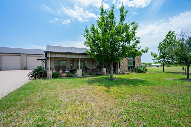 view of front of property with a front yard and a garage