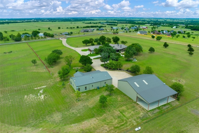 birds eye view of property with a rural view