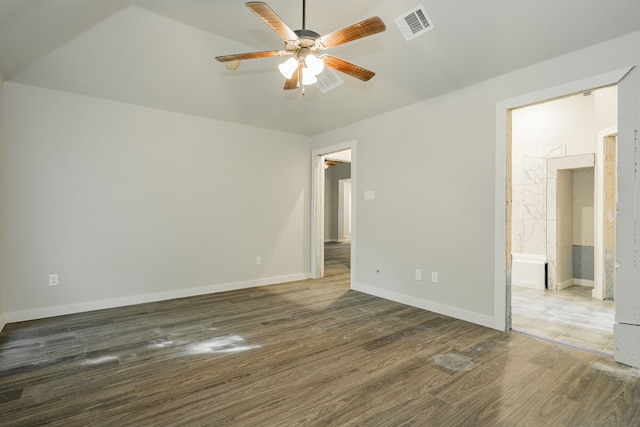 spare room with ceiling fan and dark hardwood / wood-style floors