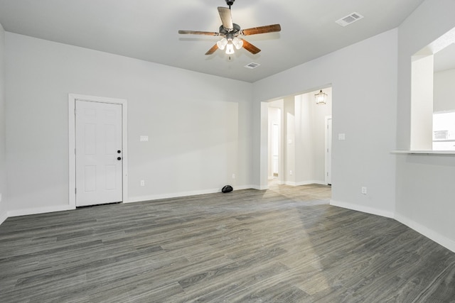 unfurnished room with dark hardwood / wood-style flooring and ceiling fan