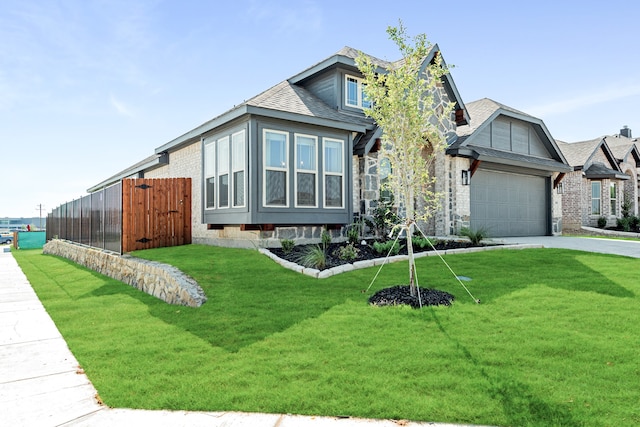 view of front facade with a garage and a front yard