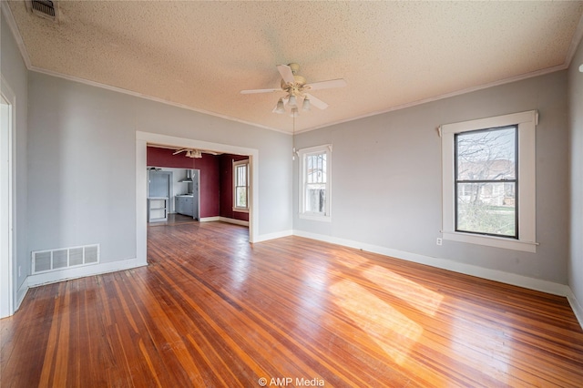 1832 Commercial Ave, Anson, TX 79501 - empty room featuring ornamental molding, dark hardwood / wood-style floors, and ceiling fan