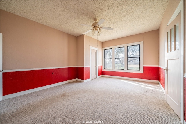 1832 Commercial Ave, Anson, TX 79501 - carpeted empty room featuring ceiling fan and a textured ceiling