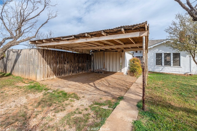 1832 Commercial Ave, Anson, TX 79501 - view of outbuilding featuring a carport and a yard