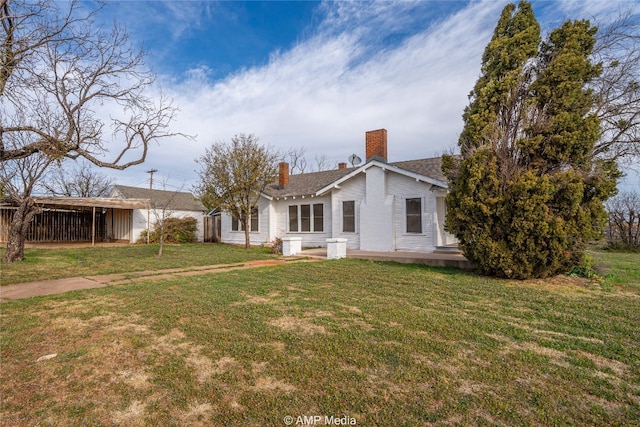 1832 Commercial Ave, Anson, TX 79501 - rear view of house featuring a yard