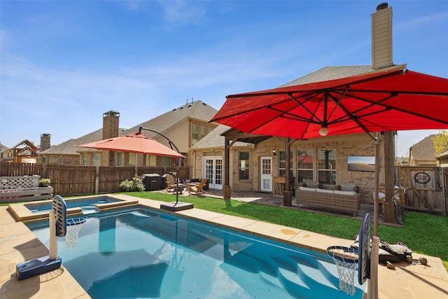 view of pool featuring french doors, a patio, an in ground hot tub, and an outdoor hangout area