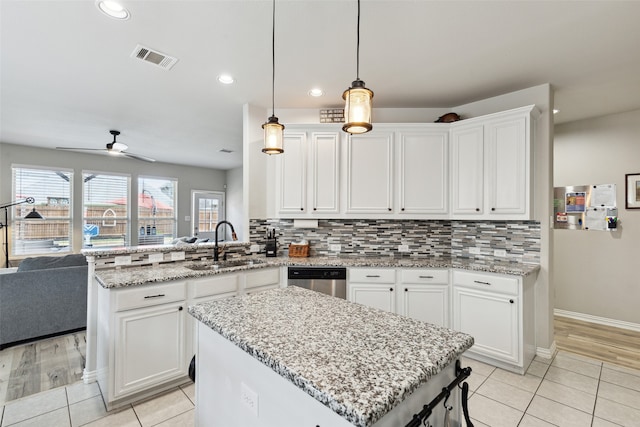 kitchen featuring sink, white cabinetry, and stainless steel appliances