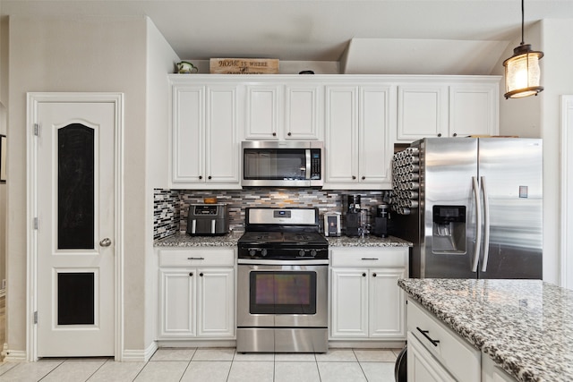 dining room featuring sink and light tile patterned floors