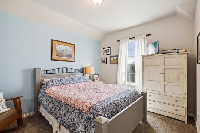 exercise room with carpet floors and vaulted ceiling