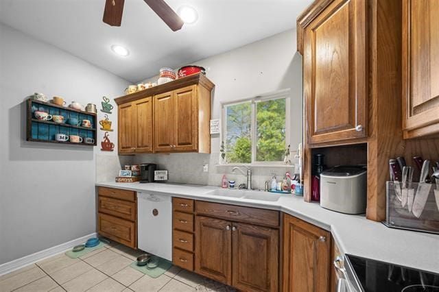 kitchen with black range oven, white dishwasher, sink, ceiling fan, and light tile patterned flooring