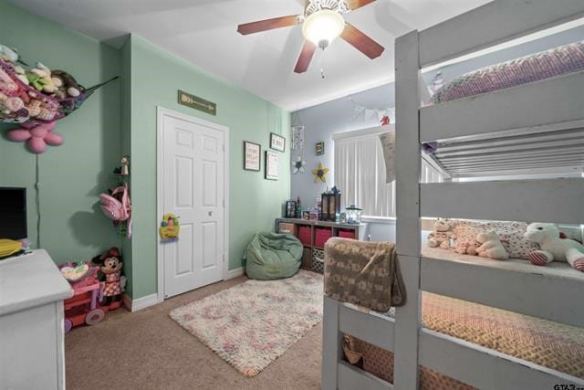 carpeted bedroom with ceiling fan