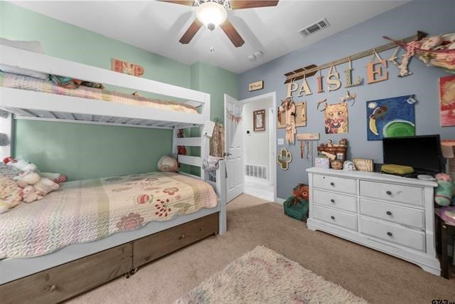 carpeted bedroom with ceiling fan